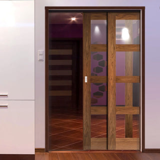 Image: Coventry Walnut Veneer Shaker Style Staffetta Twin Telescopic Pocket Doors - Clear Glass - Prefinished
