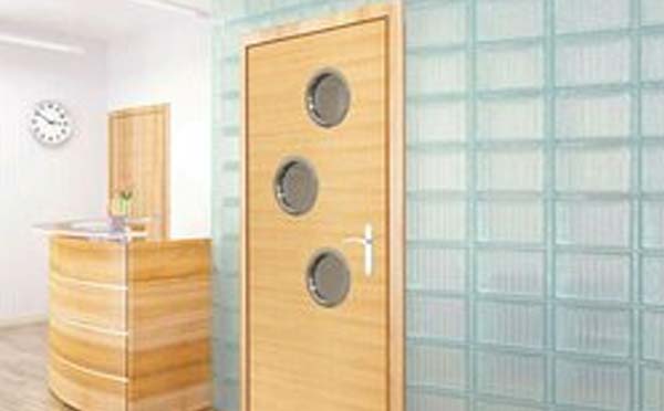 What clearance is allowable between a fire door and a frame for a fire rated door?