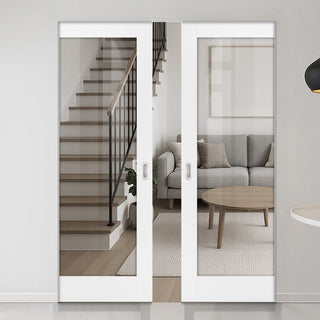 Image: Modern interior with sliding glass doors opening to a living room and staircase.