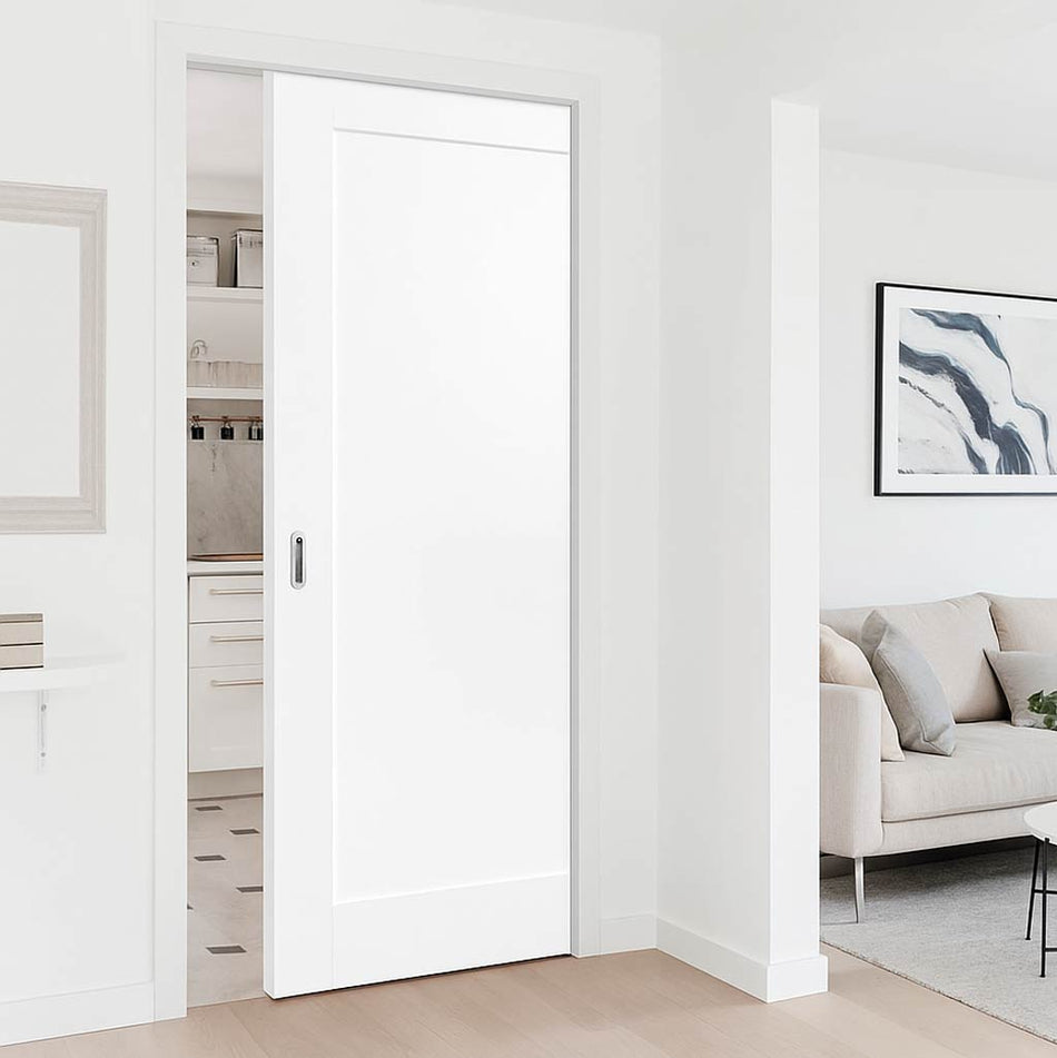 White sliding door in a modern interior setting with a sofa and artwork.