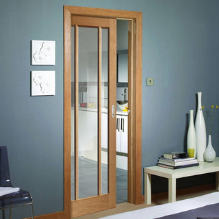 Image: Worcester Oak 3 Pane Single Evokit Pocket Door - Clear Glass - Prefinished