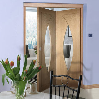 Image: Bespoke Thrufold Pesaro Oak Glazed Folding 2+0 Door - Prefinished