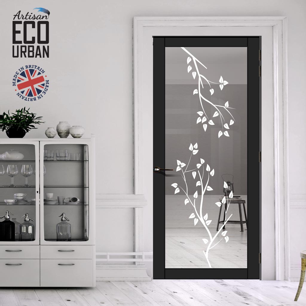 an Artisan ECO URBAN interior glazed door, featuring a black frame and a glass panel with a decorative frosted design of branches and leaves