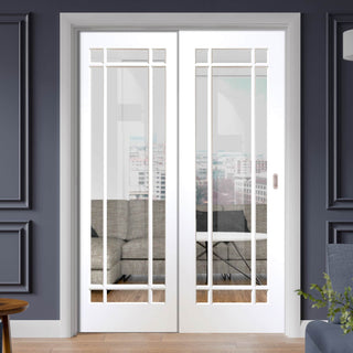 Image: Cheshire White Staffetta Twin Telescopic Pocket Doors - Clear Glass - Primed