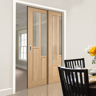 Image: Coventry Contemporary Oak Veneer Staffetta Twin Telescopic Pocket Doors - Clear Glass