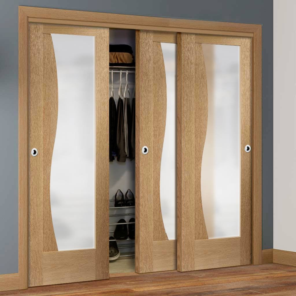 Bespoke Thruslide Emilia Oak Glazed 3 Door Wardrobe and Frame Kit - Stepped Panel Design