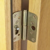 Image of a polished chrome door handle on oak door and the locking system