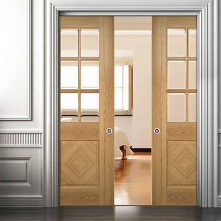 Image: Kensington Oak Panel Double Evokit Pocket Doors - Clear Bevelled Glass - Prefinished
