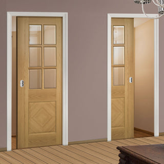 Image: Kensington Oak Panel Unico Evo Pocket Doors - Clear Bevelled Glass - Prefinished