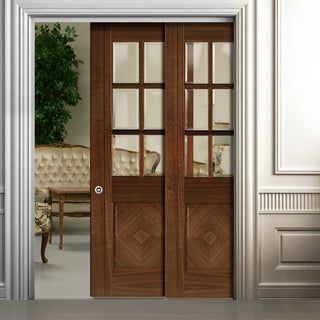 Image: Kensington Walnut Veneer Staffetta Twin Telescopic Pocket Doors - Clear Bevelled Glass - Prefinished