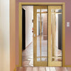 Kerry Oak Veneer Staffetta Twin Telescopic Pocket Doors - Bevelled Clear Glass - Unfinished