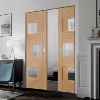 Image: Perugia Oak Panel Absolute Evokit Double Pocket Door - Clear Glass - Prefinished