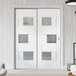Image: Perugia White Panel Staffetta Twin Telescopic Pocket Doors - Clear Glass - Prefinished