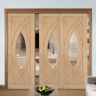 Image: Bespoke Thruslide Treviso Oak Glazed - 3 Sliding Doors and Frame Kit - Prefinished