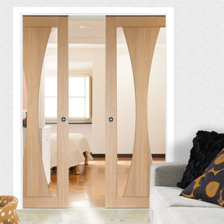 Image: Verona Oak Double Evokit Pocket Doors - Clear Glass - Prefinished